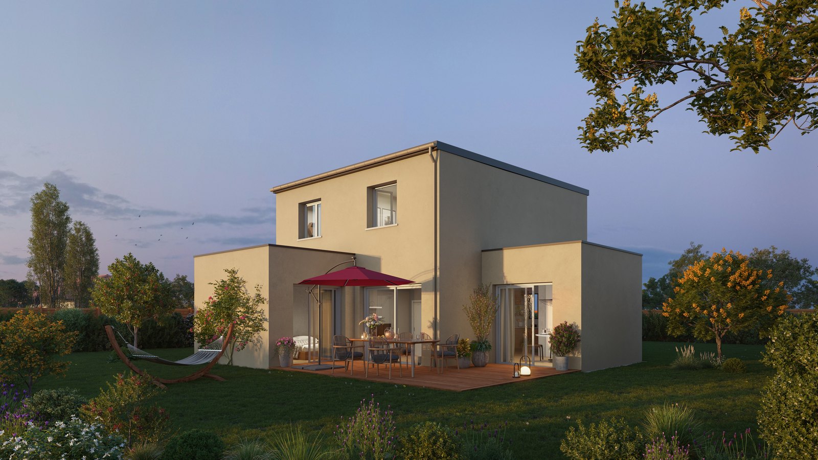 A newly built villa with its terrace and garden at dusk, of the type built on the Presqu'île de Rhuys in the Morbihan